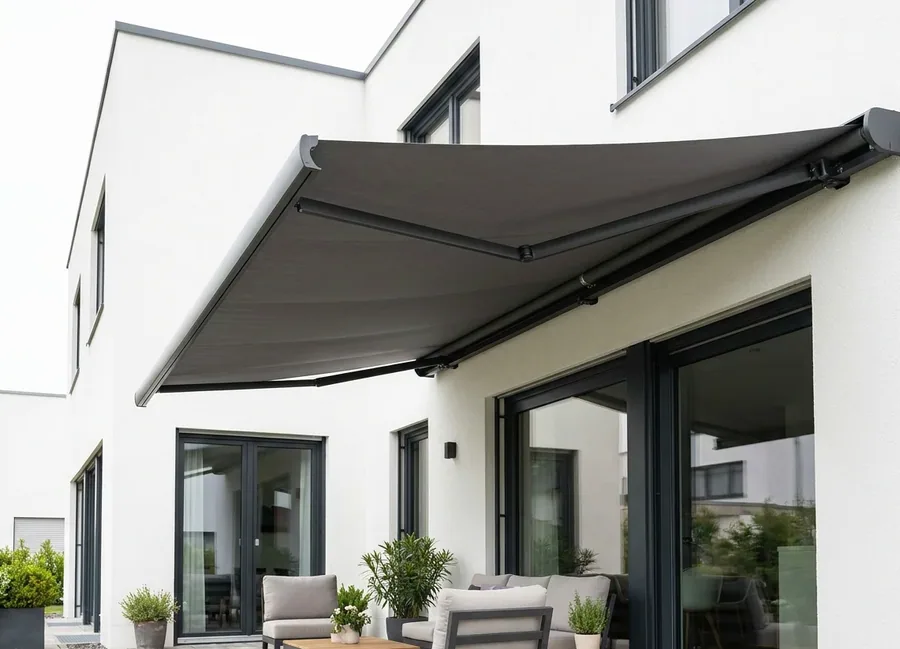 Folding-arm awning extended over a small balcony in a leafy Illovo apartment complex